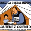 Un uomo scrive con una ragazza vicino, in una tenda, promuovendo la stampa indipendente.