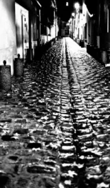 A face of grayness: An empty Parisian street on a rainy night — Courtesy: Regis Frasseto, via Flickr