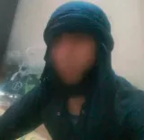 Photo de profil WhatsApp d'Obeyd dans un ensemble typique des combattants de l'Organisation de l'État islamique (OEI)