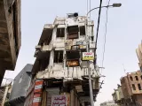Comme celui-ci, des milliers de bâtiments dans Mossoul gardent des impacts de balles ou d'explosions