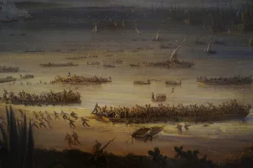L'image représente une scène de bataille ou de débarquement maritime. On y voit plusieurs bateaux et embarcations sur une étendue d'eau, avec beaucoup de personnes à bord. Sur la rive, des groupes de soldats ou de guerriers semblent se préparer à l'assaut ou à un combat. L'arrière-plan montre des voiliers et des structures, ce qui suggère un port ou une plage animée. L'atmosphère paraît dynamique et chargée d'action, avec des personnages en mouvement, créant une impression de chaos et de détermination.