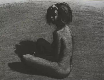 The image depicts a nude figure seated with their back to the viewer, captured in a monochromatic charcoal style. The figure has a slightly turned profile, showcasing a sense of contemplation. The body is rendered with soft, flowing lines, contrasting against the darker, shadowy background. The light appears to create a dramatic play of shadows, emphasizing the contours and curves of the figure. The overall mood is introspective and artistic, focusing on the human form and its relationship with light and darkness.